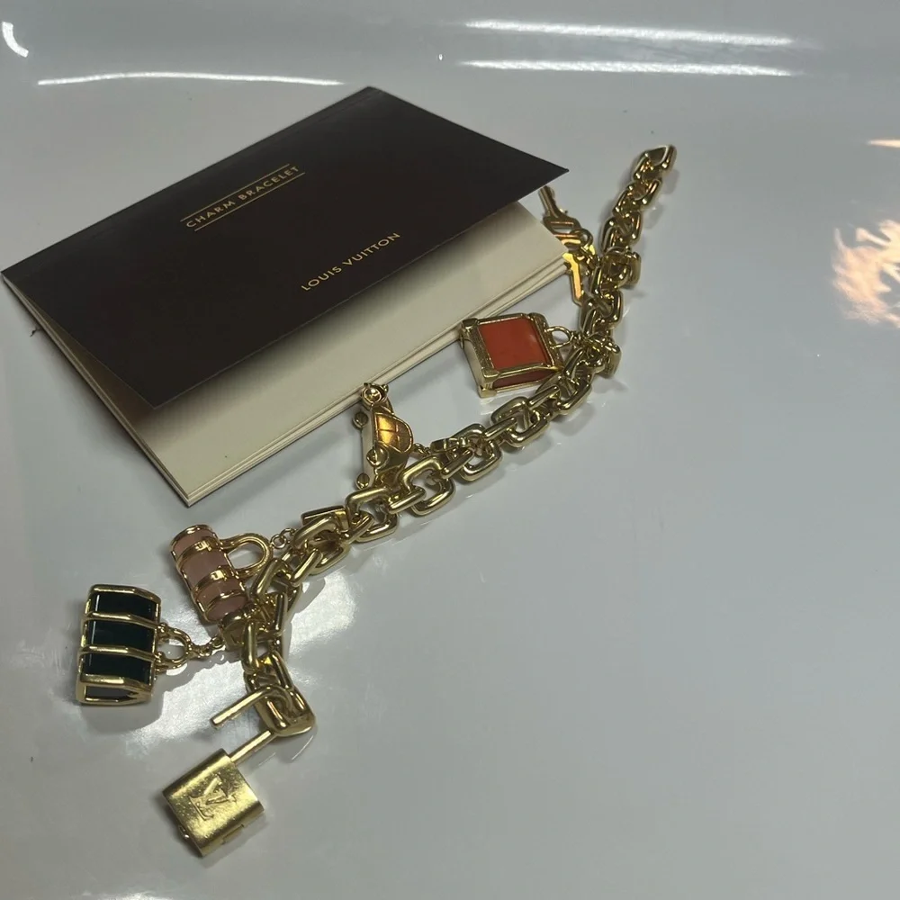 LOUIS VUITTON 2003 18KT GOLD CHARM BRACELET W/ 5 CHARMS - Picture 11 of 14